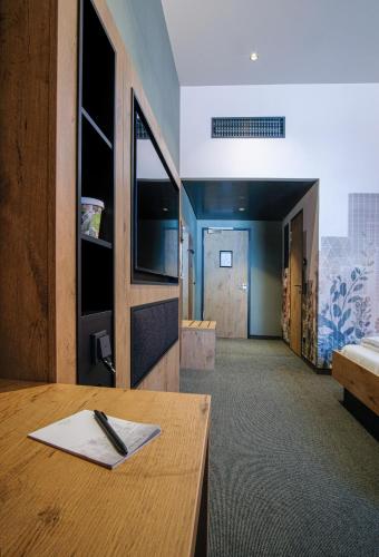 Una cama o camas en una habitación de RiKu HOTEL Göppingen