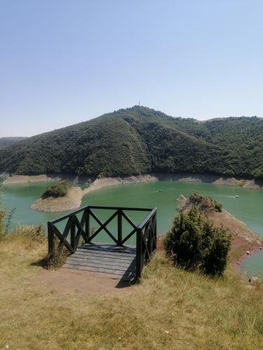 a wooden bridge over a body of water at Apartmani NECA Zlatar in Nova Varoš