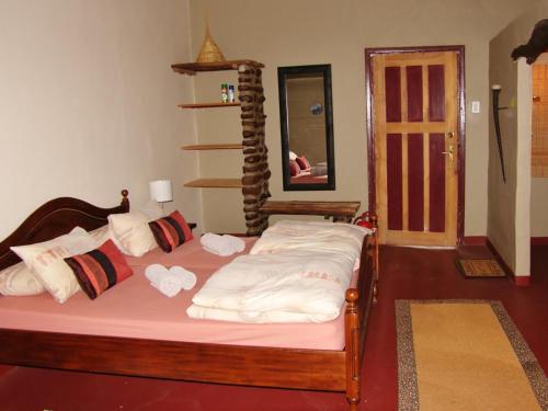 Postel nebo postele na pokoji v ubytování Roidina Safari Lodge