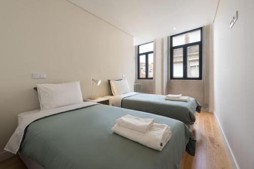 Кровать или кровати в номере BmyGuest - Sao Vitor Balcony Apartment