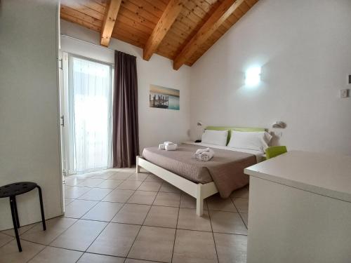 Postel nebo postele na pokoji v ubytování Hotel Sasselli