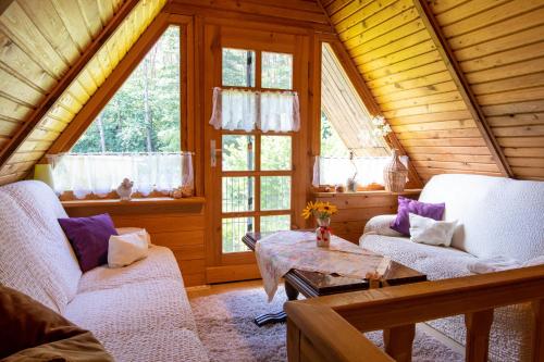 a living room with two couches and a table at Ferienhaus Gitti in Freest