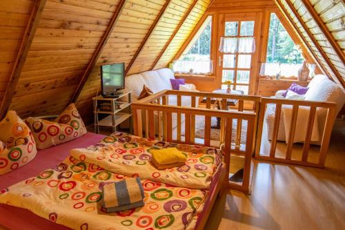 a room with two beds in a log cabin at Ferienhaus Gitti in Freest