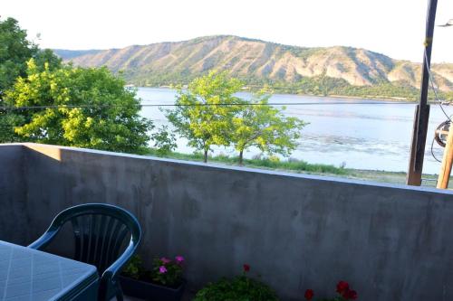 a balcony with a view of a lake at IDILA in Kladušnica