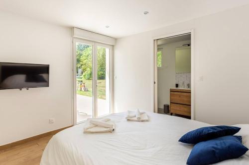 Postel nebo postele na pokoji v ubytování La Grignotière Lodge & Spa