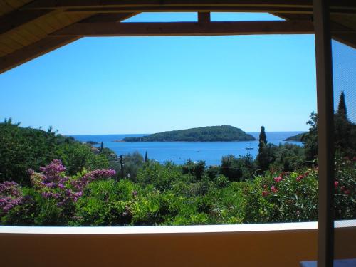 a view of a lake from a window at Apartment Luna in Molunat