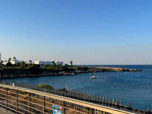 a body of water with a boat in it at Lovely cozy one bedroom suite with pool in Protaras