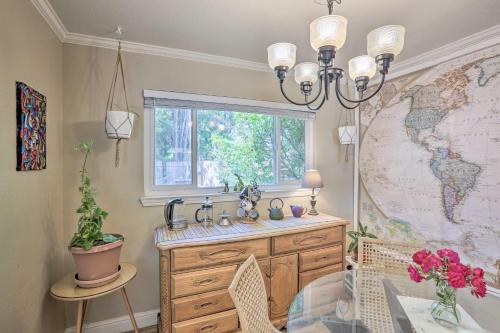 a bathroom with a sink and a window and a map at Whimsical Sacramento Home with Garden and Patio! in Sacramento