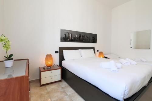 Кровать или кровати в номере PrimoPiano - Tertulliano