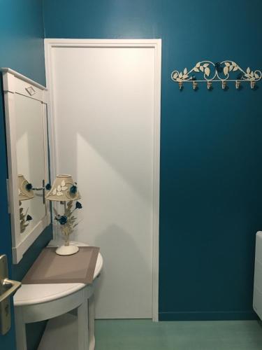 a bathroom with a sink and a mirror at A 50m de la mer in Agon Coutainville