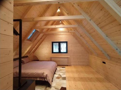 Voodi või voodid majutusasutuse National Park Sauna Retreats - Villa 68 Pines toas