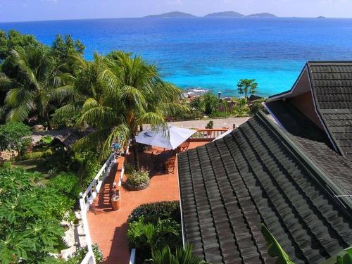 an aerial view of a resort with a beach and the ocean at Hotel L'Ocean in La Digue