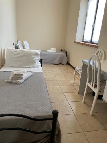 Postel nebo postele na pokoji v ubytování Agriturismo con cucina Il Favaio