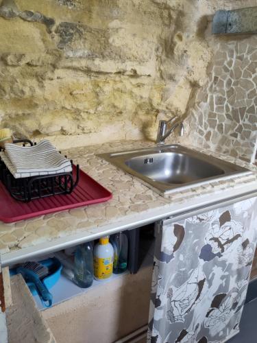a kitchen with a sink and a counter top at Le Gite de la Loire in Rochecorbon