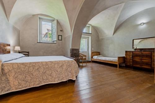 Posteľ alebo postele v izbe v ubytovaní Gli Iris Apartments by Wonderful Italy