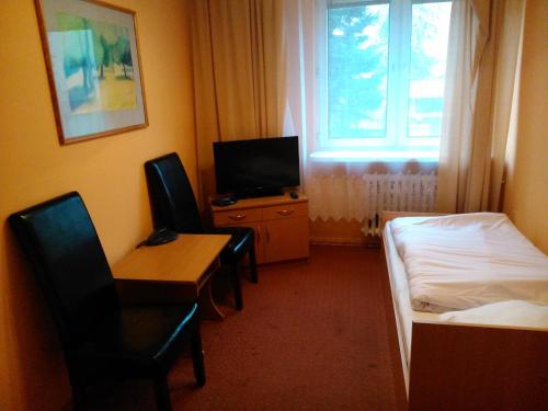 TV a/nebo společenská místnost v ubytování Hostel Refleks