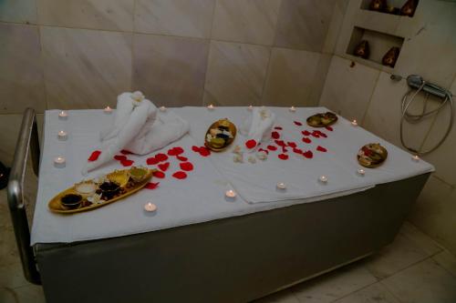 a table in a bathroom with flowers on it at Novotel Mohammedia in Mohammedia