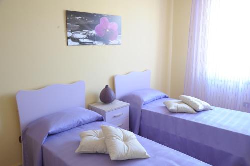 Postel nebo postele na pokoji v ubytování B&B Abitazione Sandra