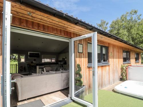 an open living room and patio with sliding glass doors at Lodge 32 in Newcastle upon Tyne