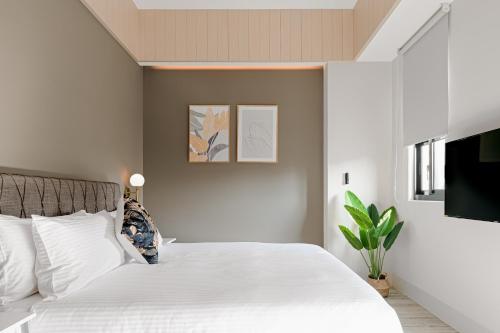 Postel nebo postele na pokoji v ubytování 森行旅 Mori Hotel -台南安平老街