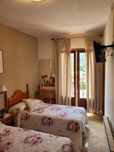 Katil atau katil-katil dalam bilik di Allotjament rural Casa Milagros