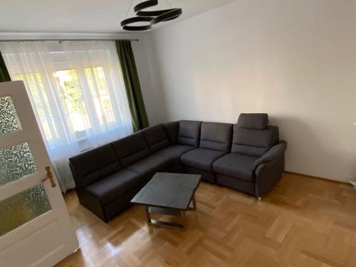 A seating area at Subarini Garden Apartment