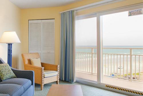 a living room with a view of the ocean at Fantasy Island II in Daytona Beach Shores