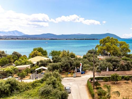 a view of a lake with mountains in the distance at Palmeira Studio in Preveza