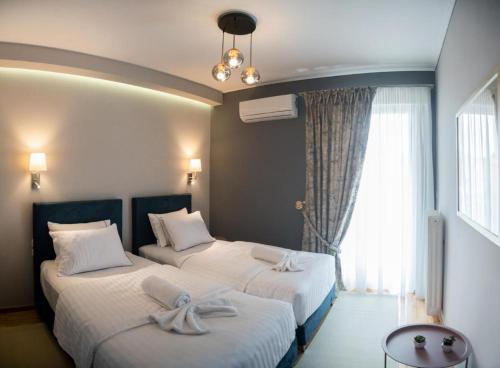 Posteľ alebo postele v izbe v ubytovaní Filoxenia Home Ioannina