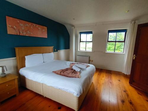 Кровать или кровати в номере Clós Na Feirme