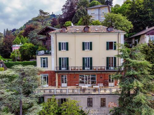 an old house on a hill with trees at Villa I Tigli - by MyHomeInComo in Brunate