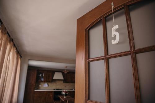 a sliding glass door with the number on it at Le Antiche Colonne in Cinquefrondi