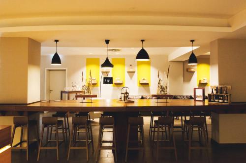 a large kitchen with a large wooden island in a room at Weinhotel Kaisergarten in Alzey