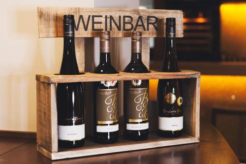 a crate of wine bottles on a table at Weinhotel Kaisergarten in Alzey
