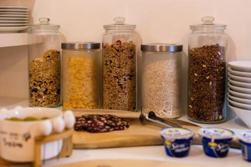 a group of glass jars filled with different types of spices at Grand Lakes 2 in Plitvička Jezera