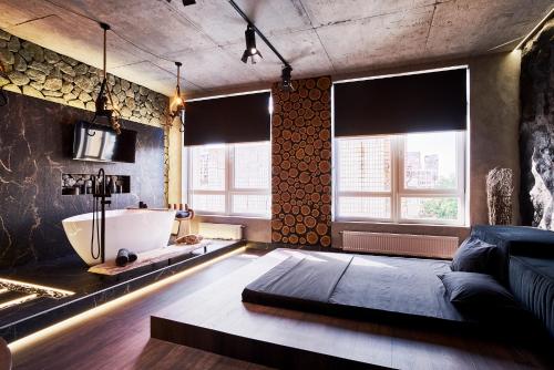 Postel nebo postele na pokoji v ubytování KADOR HOME HOTEL downtown