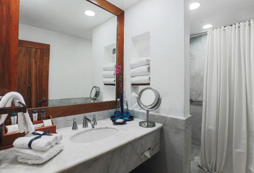 a bathroom with a sink and a mirror at Quinta Real Oaxaca in Oaxaca City