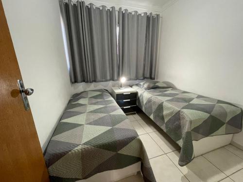 Кровать или кровати в номере Apartamento em Vila Velha, Itaparica