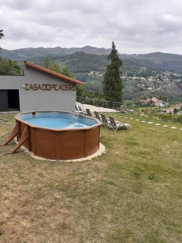 a hot tub in the backyard of a house at Casa da Cerca - Picadeiro 1 in Braga