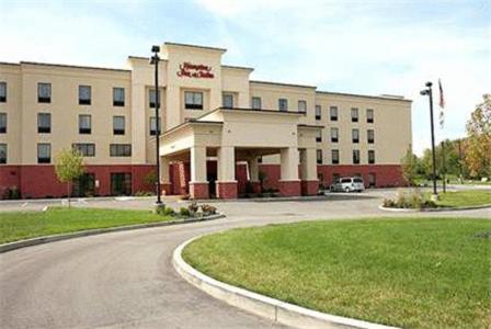 a large building with a parking lot in front of it at Hampton Inn & Suites Dayton-Airport in Englewood