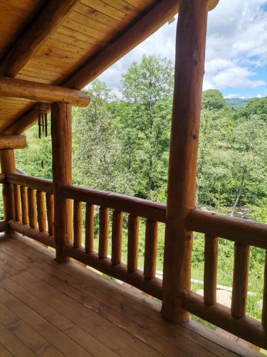 a view from the porch of a cabin at Cabana Casa de Piatra, de la Mara in Deseşti