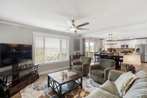 a living room with a couch and a table at HoneyHomes Spectacular View Home with Amenities in Sumner