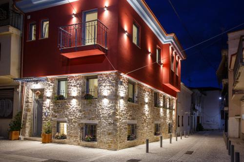 a building with lights on the side of it at ΟNIRO Comfort Living in Ioannina