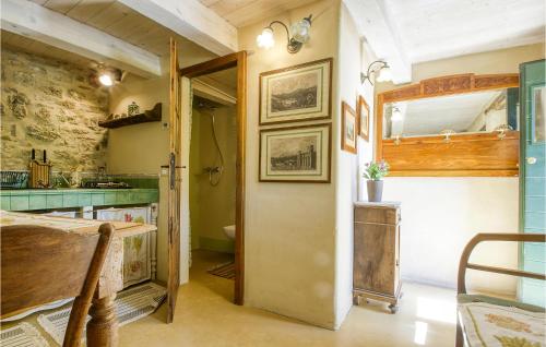 a kitchen with a door leading into a kitchen with a sink at 1 Bedroom Gorgeous Apartment In Villagrande Di Monteco 