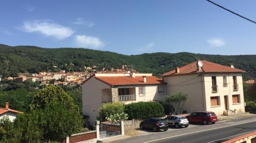 a group of cars parked in front of a house at beautiful apartment with garden in Amélie-les-Bains-Palalda