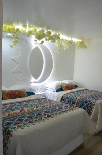 A bed or beds in a room at Vicalis Hotel, Villas y Glamping