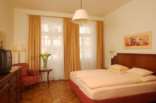 Un pat sau paturi într-o cameră la City Appartements - Hotel City Central