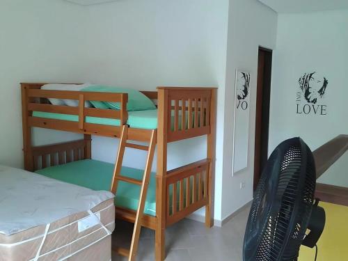 Ένα ή περισσότερα κρεβάτια σε δωμάτιο στο Maresias Flats Unidade I