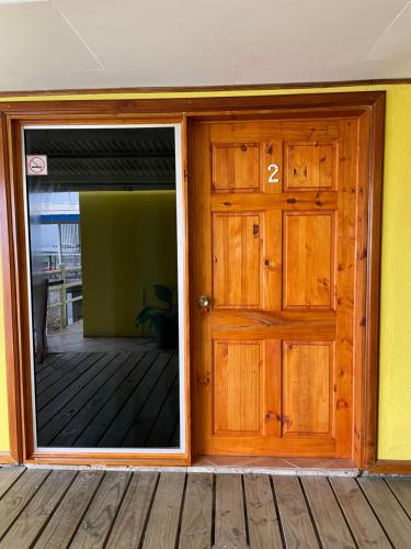 an open door of a house with a patio at Banana Bay Marina in Golfito