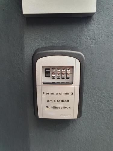 an electronic device is attached to a wall at Ferienwohnung am Stadion Bochum Grumme in Bochum